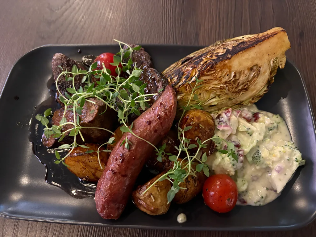 The anniversary plate - reindeer sausage, roasted whale and lamb tenderloin